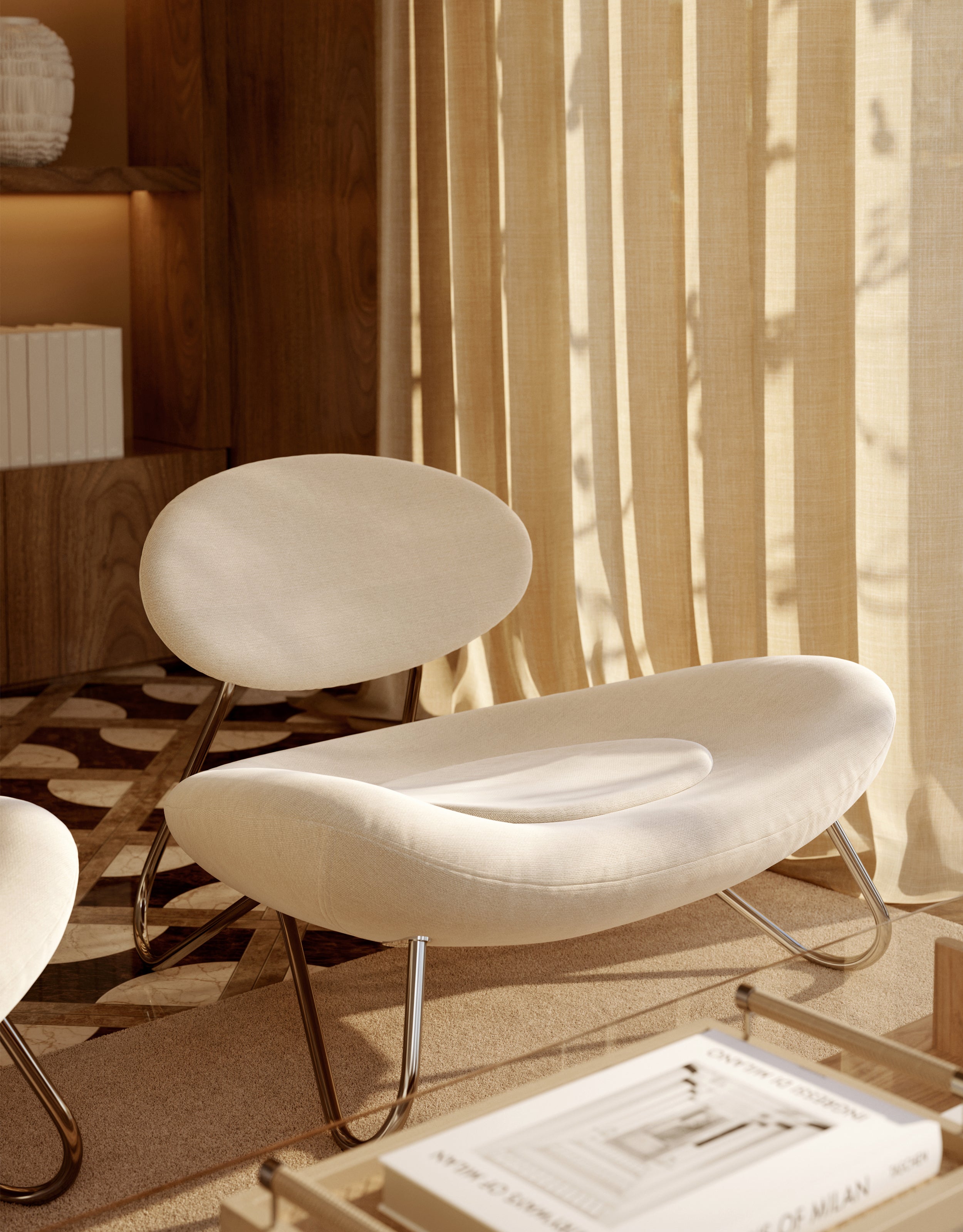 Scandinavian lounge chair in off-white with chrome steel frame, lit by sunlight through curtains.
