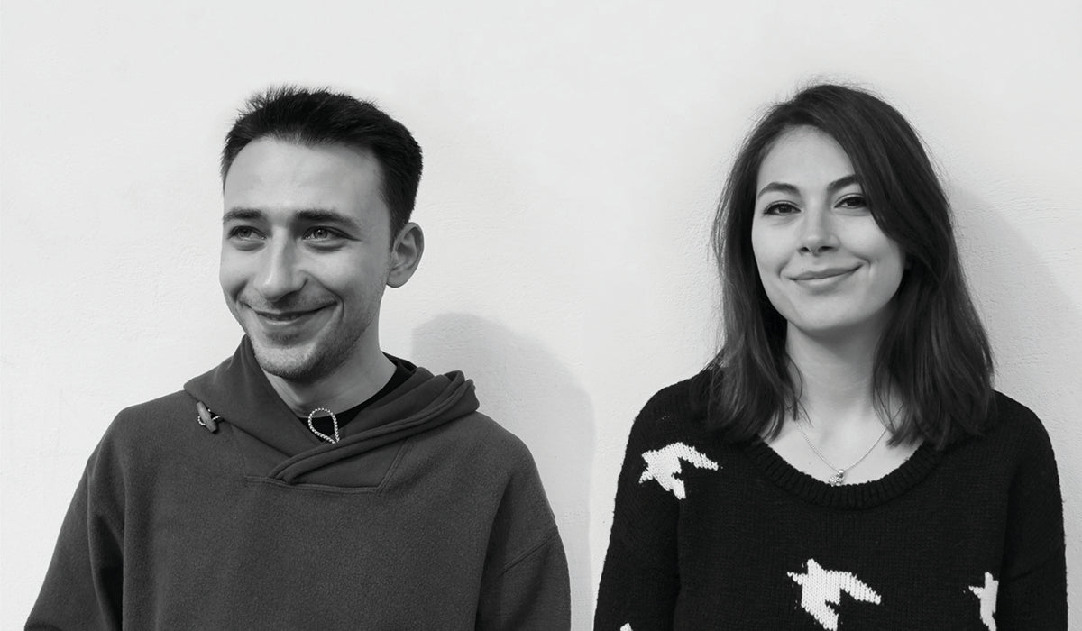 Black-and-white portrait of designers Mira Ene and Codrin Stanciulescu, founders of 201 Design Studio.