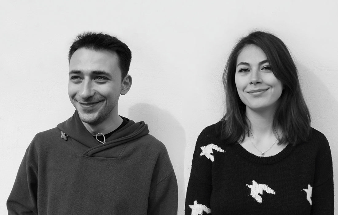 Black-and-white portrait of designers Mira Ene and Codrin Stanciulescu, founders of 201 Design Studio.
