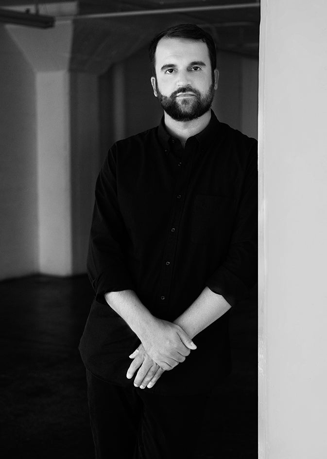 Black-and-white portrait of designer Adam Miller, founder of AD Miller.