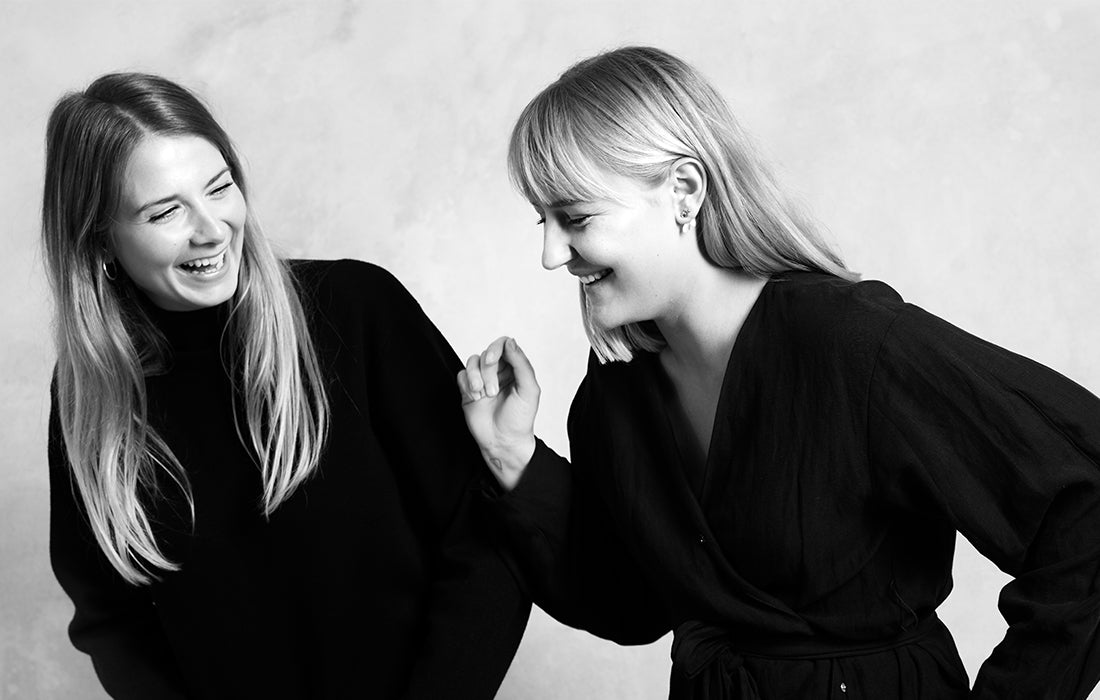 Black-and-white portrait of the designers Julie Begtrup and Ditte Vad.