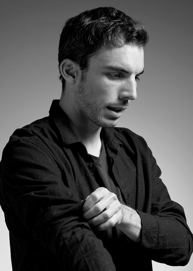 Black-and-white portrait of designer Jordi López Aguiló, founder of KUTARQ Studio.