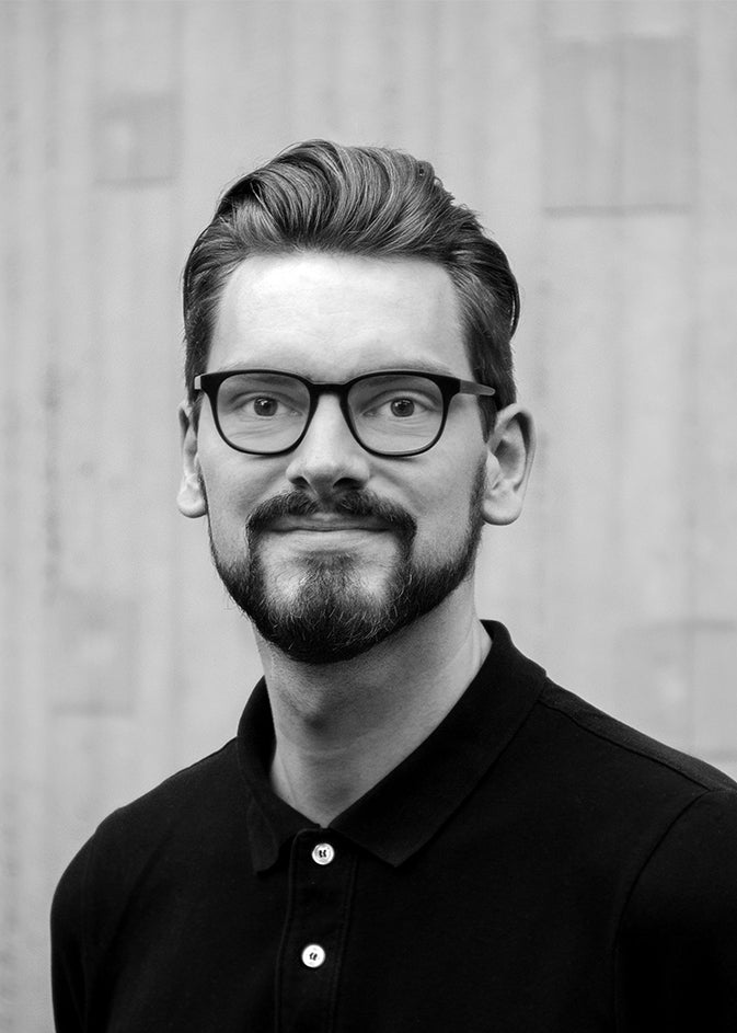 Black-and-white portrait of designer Leonard Aldenhoff.