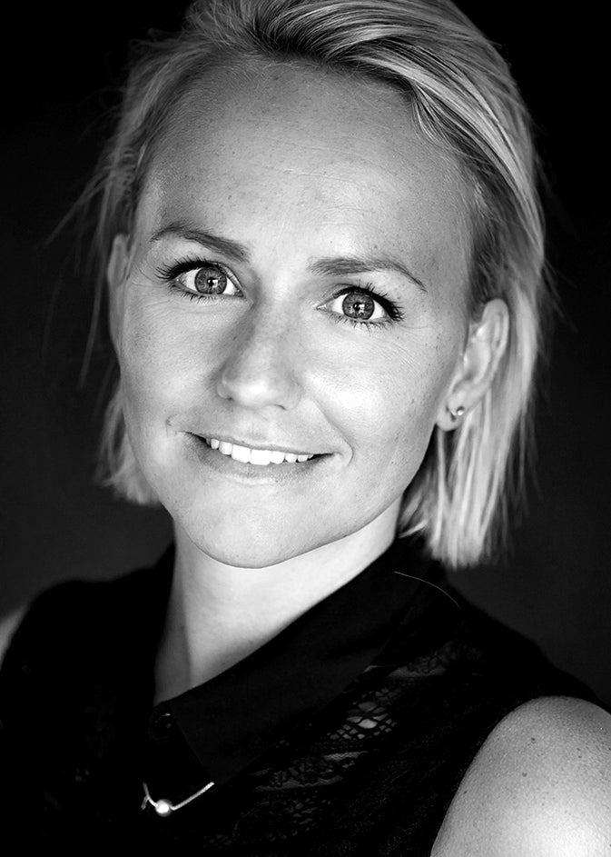 Black-and-white portrait of designer Maja Vindbjerg.