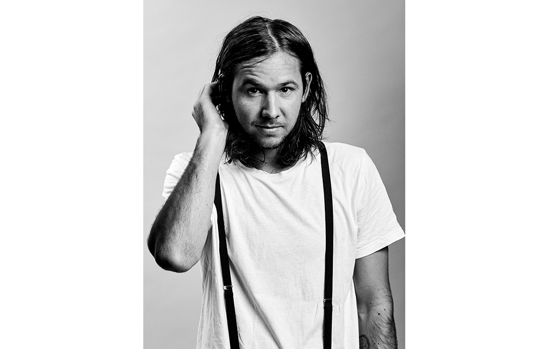 Black-and-white portrait of designer Michael Christensen, founder of Michael Daae Studio.