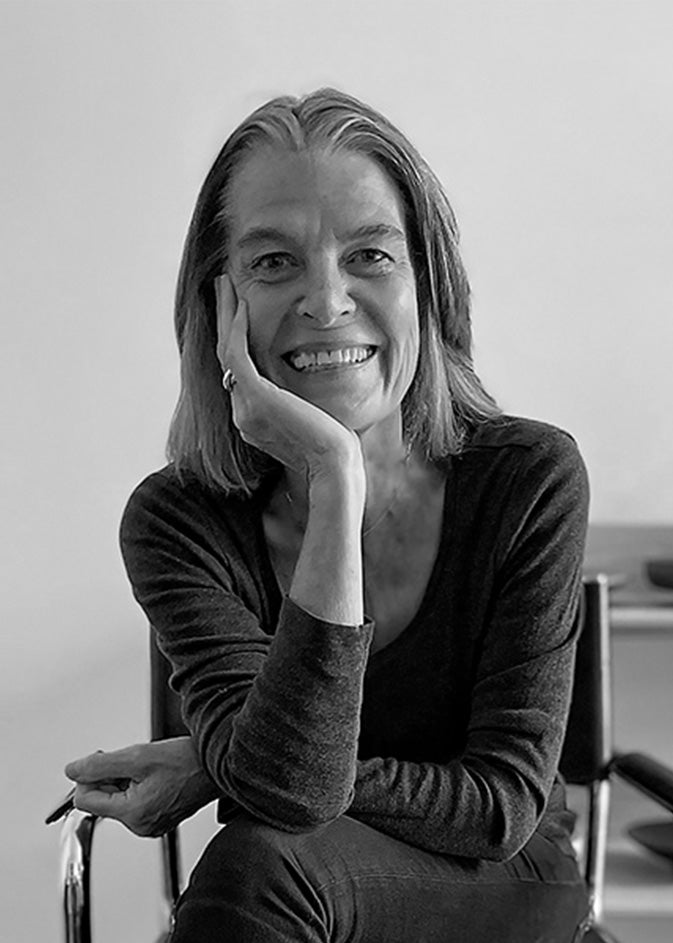 Black-and-white portrait of designer Rachael Heritage.