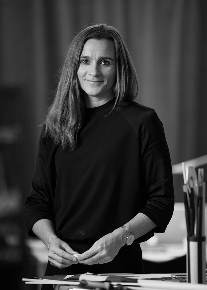 Black-and-white portrait of designer Rikke Frost.