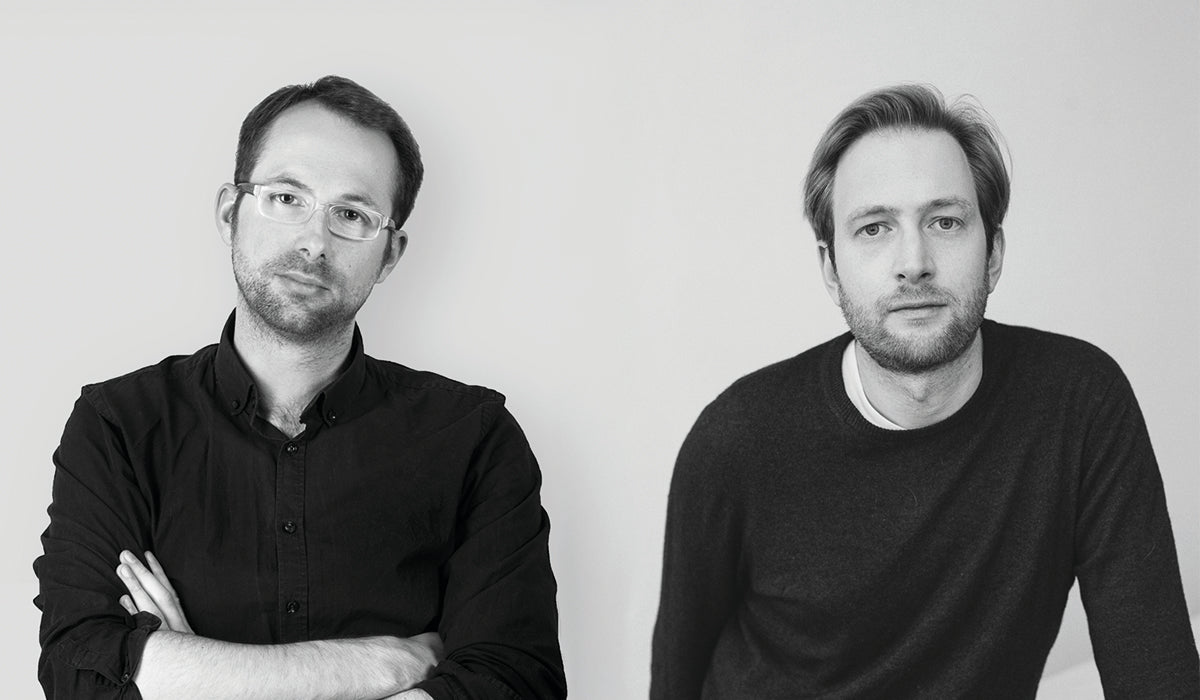Black-and-white portrait of designers Maximilian Schmahl and Fabian Schnippering founders of the design studio Schmahl + Schnippering.
