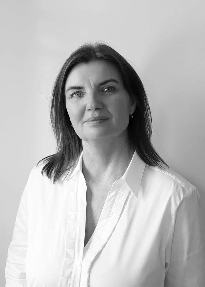 Black-and-white portrait of designer Tina Schmidt.