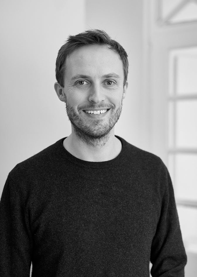 Black-and-white portrait of designer Peter Otto Vosding, founder of the design studio VOSDING Industrial Design.