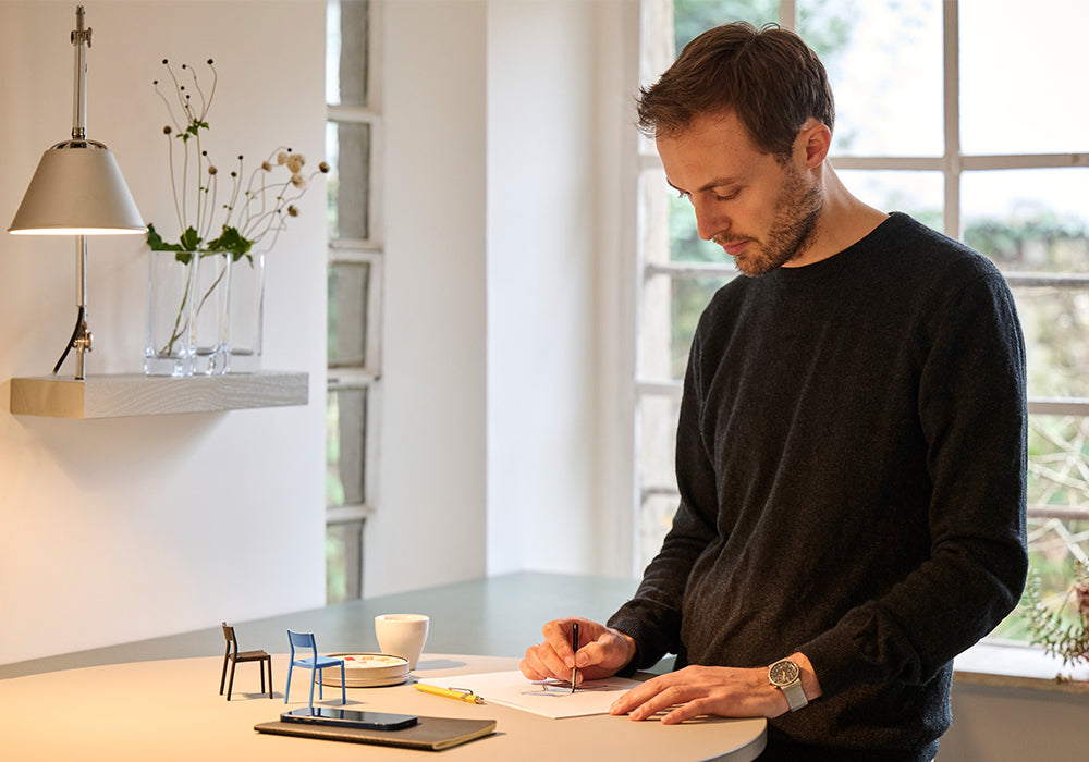 Designer Peter Otto Vosding, founder of the design studio VOSDING Industrial Design sketching creative designs.