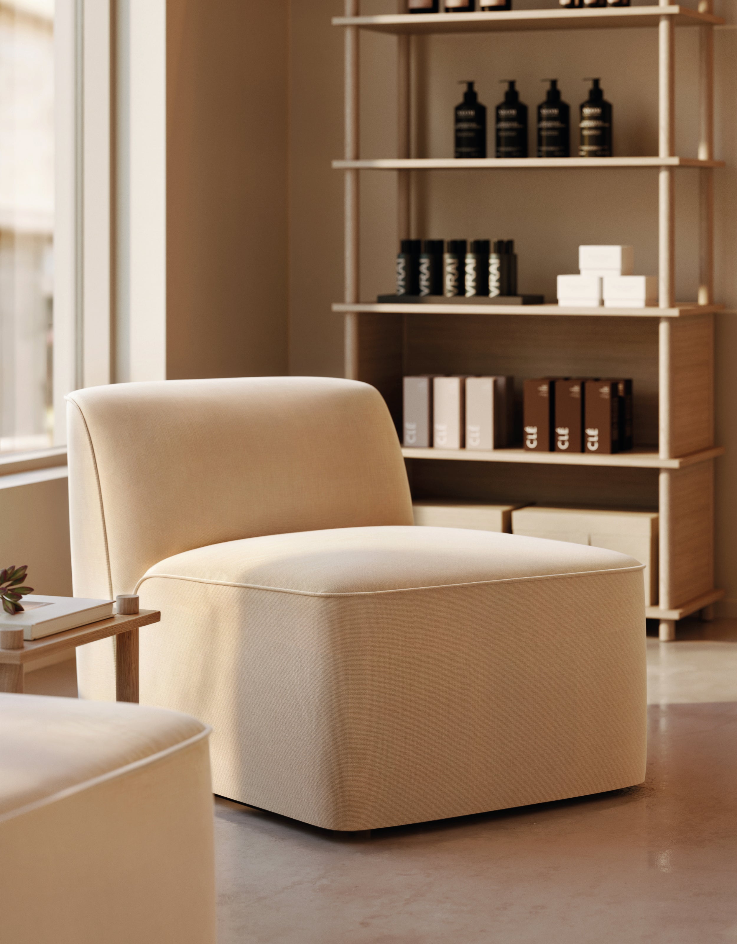 Single beige sofa module lit by natural sunlight